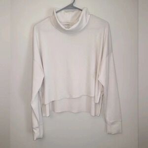 American Eagle crop top turtle neck long sleeve cream colored women's size med